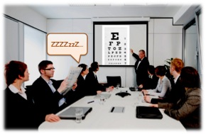 Presenter projecting an optometric eye chart on the screen that is putting people to sleep