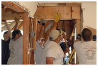 Students installing new beams where walls once stood